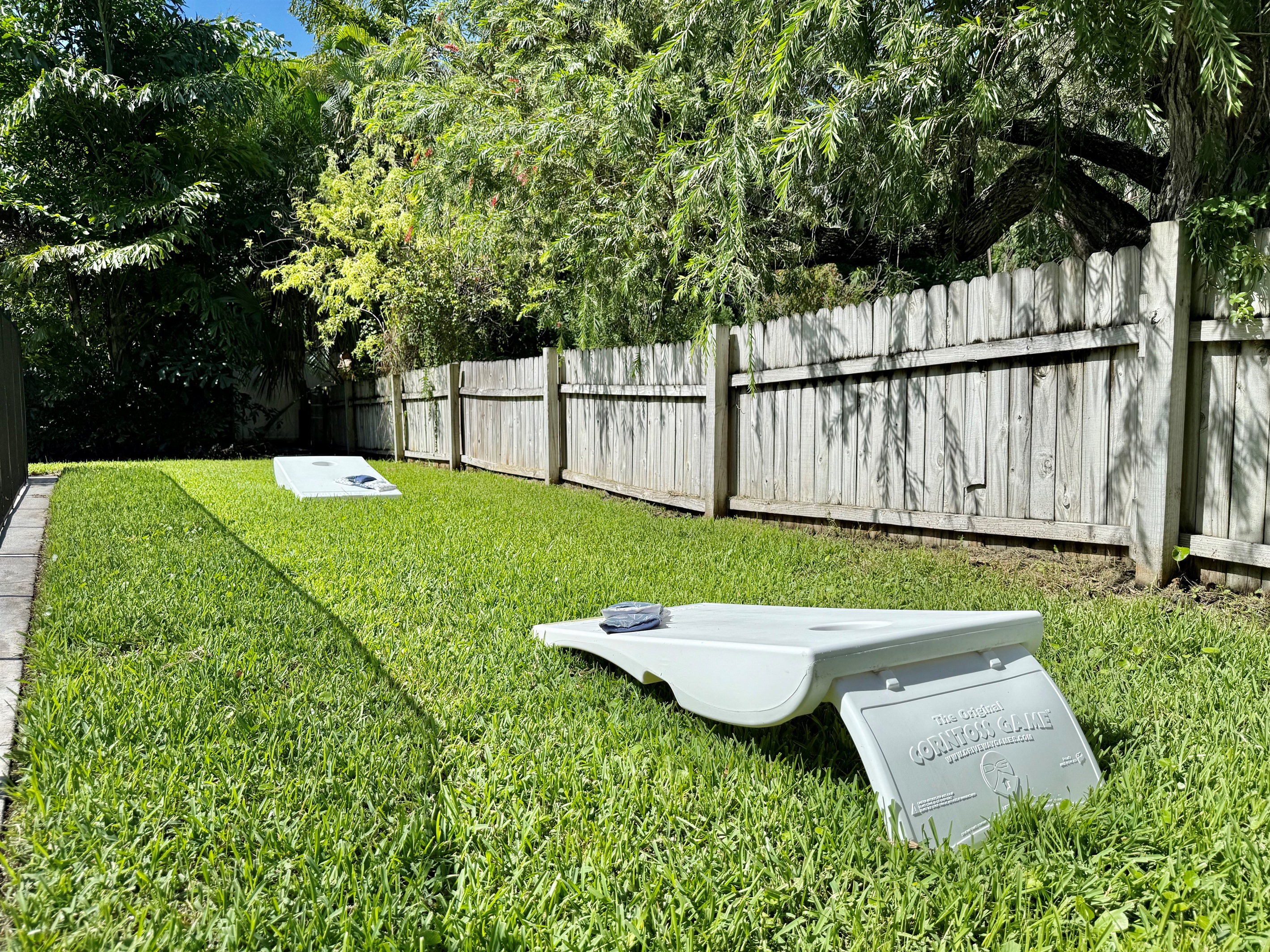 Cornhole tournaments by day, stargazing by night — this yard has it all.