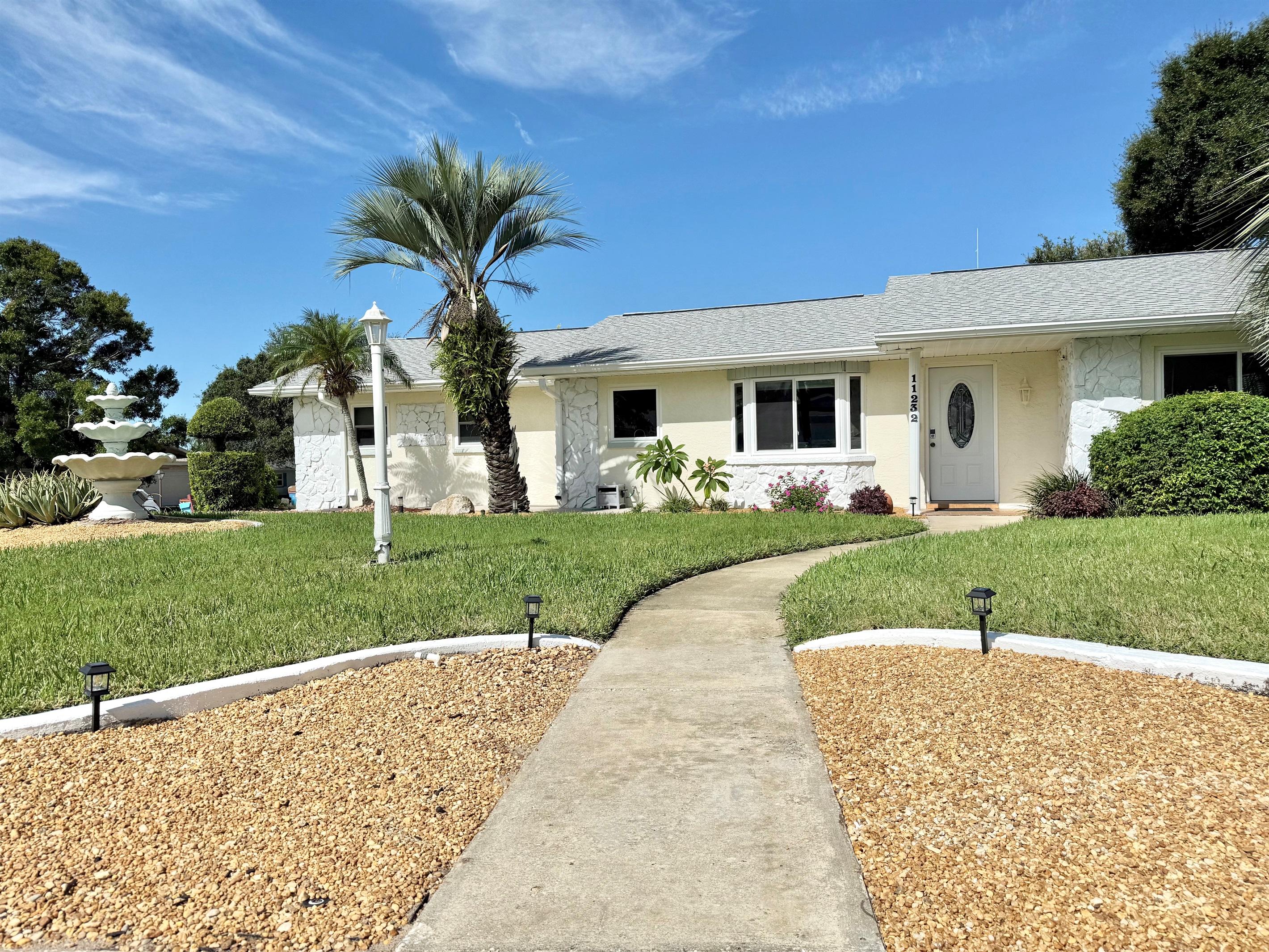 Corner lot. Landscaped and lavish front yard. The house is set back from the street for peace and privacy.