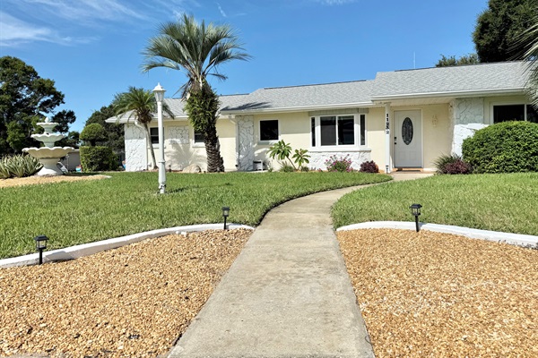 Corner lot. Landscaped and lavish front yard. The house is set back from the street for peace and privacy.