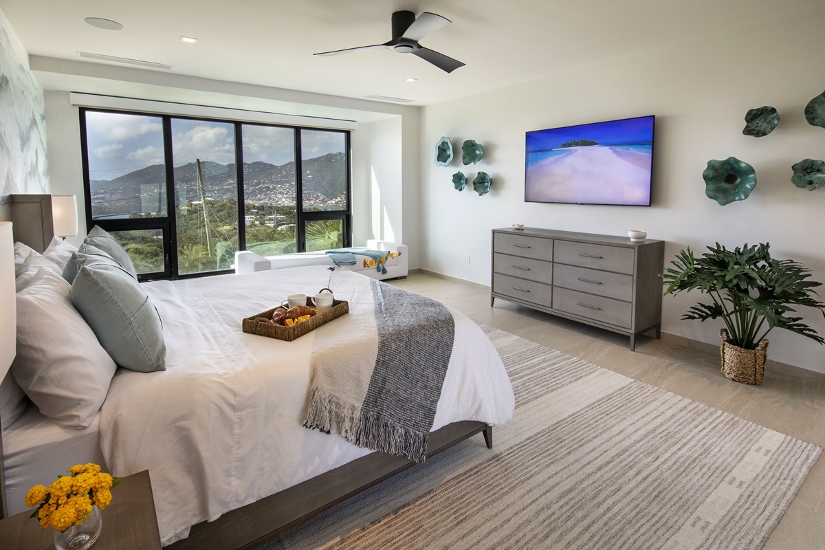 Primary bedoom 2 - with day bed and stunning views. Located on the second level in a corner suite.