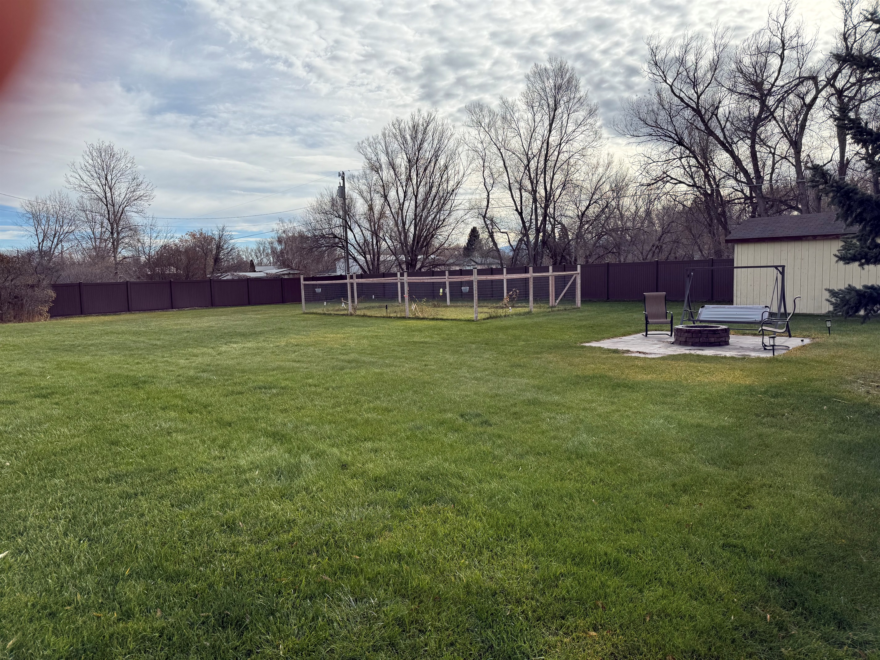 Fire pit and garden in back yard