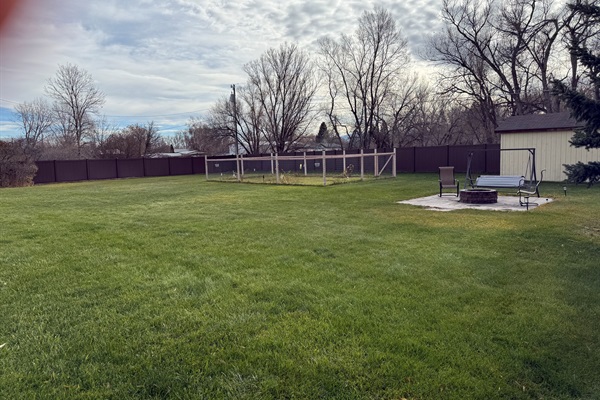 Fire pit and garden in back yard