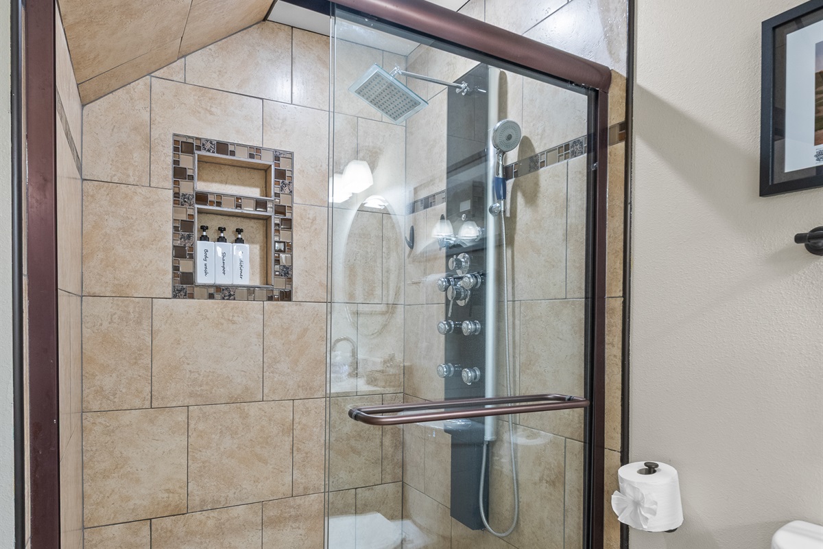 Master bath shower featuring multiple shower heads & body sprays.