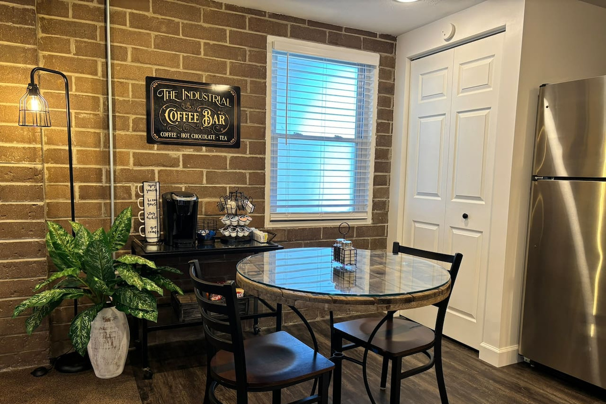 Cozy kitchen table to enjoy a meal, morning coffee, or sip of tea. Fully stocked coffee bar included!