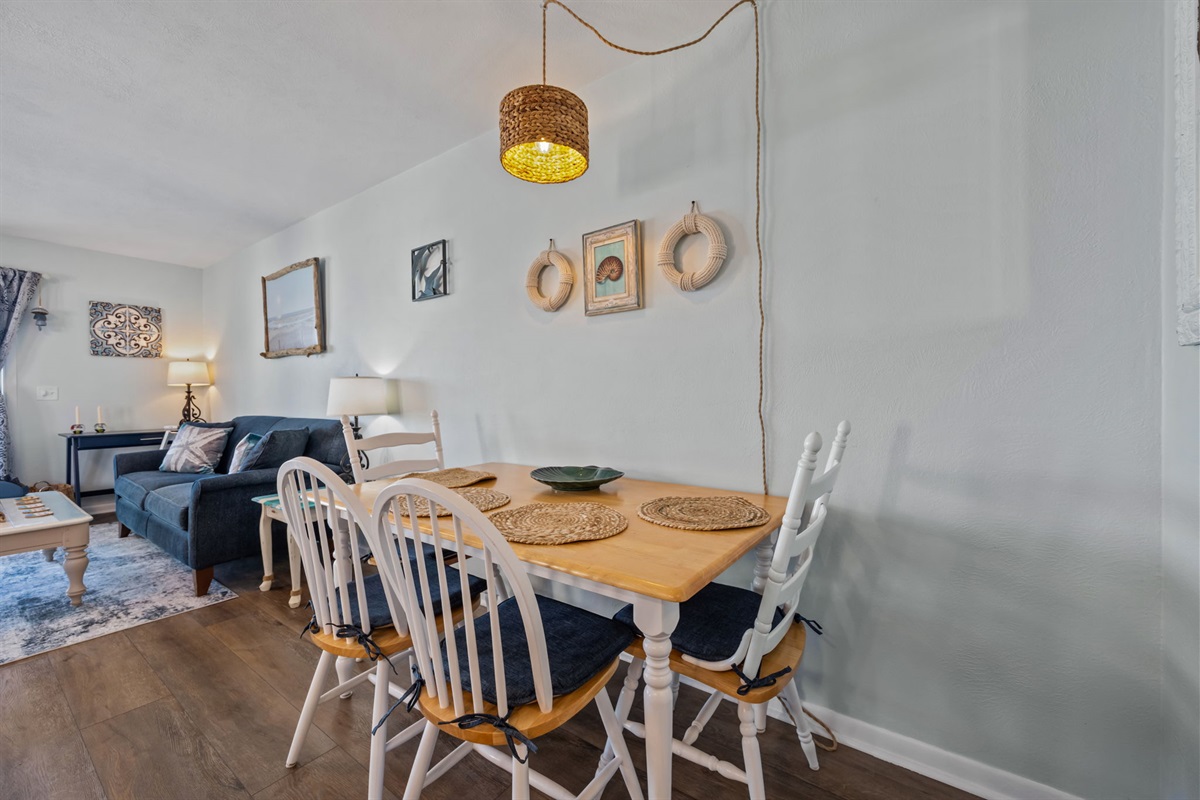 Gather around the dining table for meals, games, or planning your next beach day