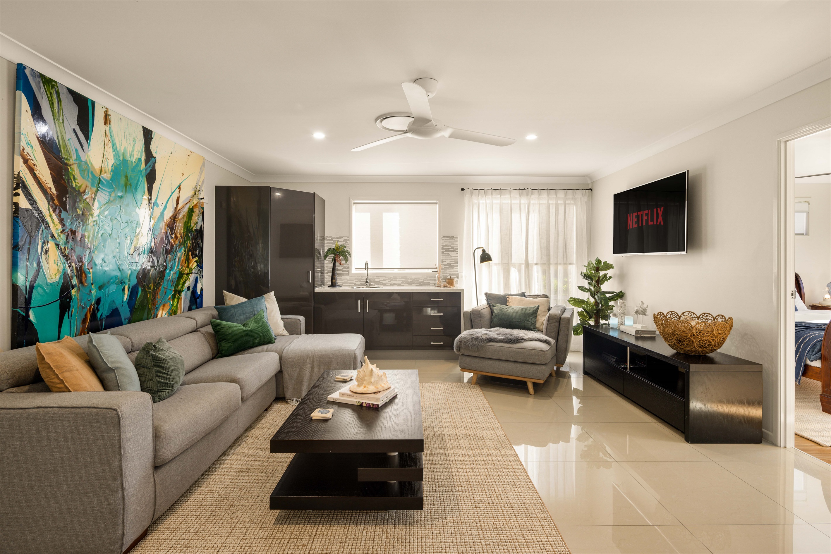Upstairs retreat lounge with smart TV, Foxtel Premium, gaming console and library selection