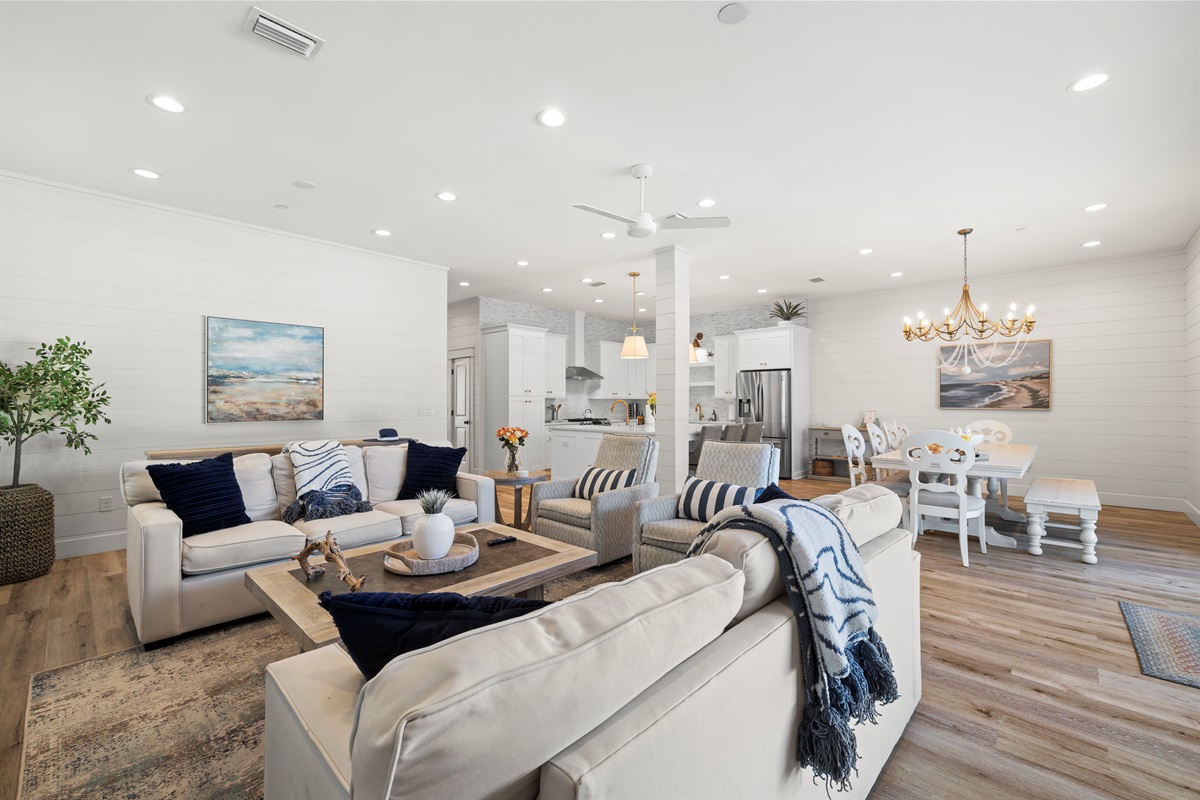 Living room is just off of the kitchen and dining room and overlooks the pool deck