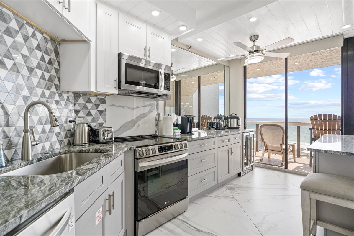 Fully stocked and beautifully finished, this kitchen is as functional as it is stunning. Cook a full meal, pour a glass from the wine fridge, and watch the Gulf from the comfort of your own home.
