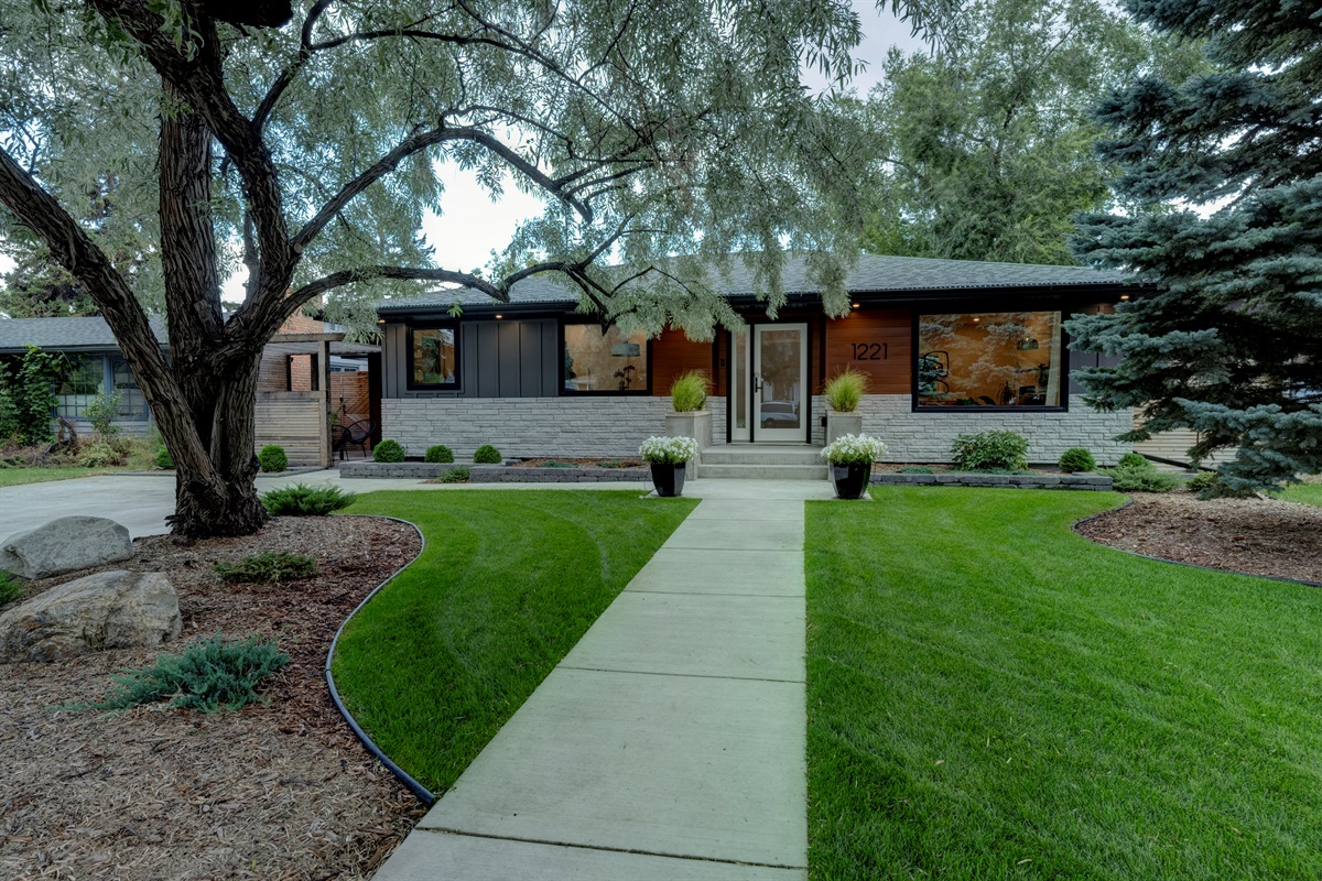 Exterior of the home — the guest suite entrance is through the pergola on the left.