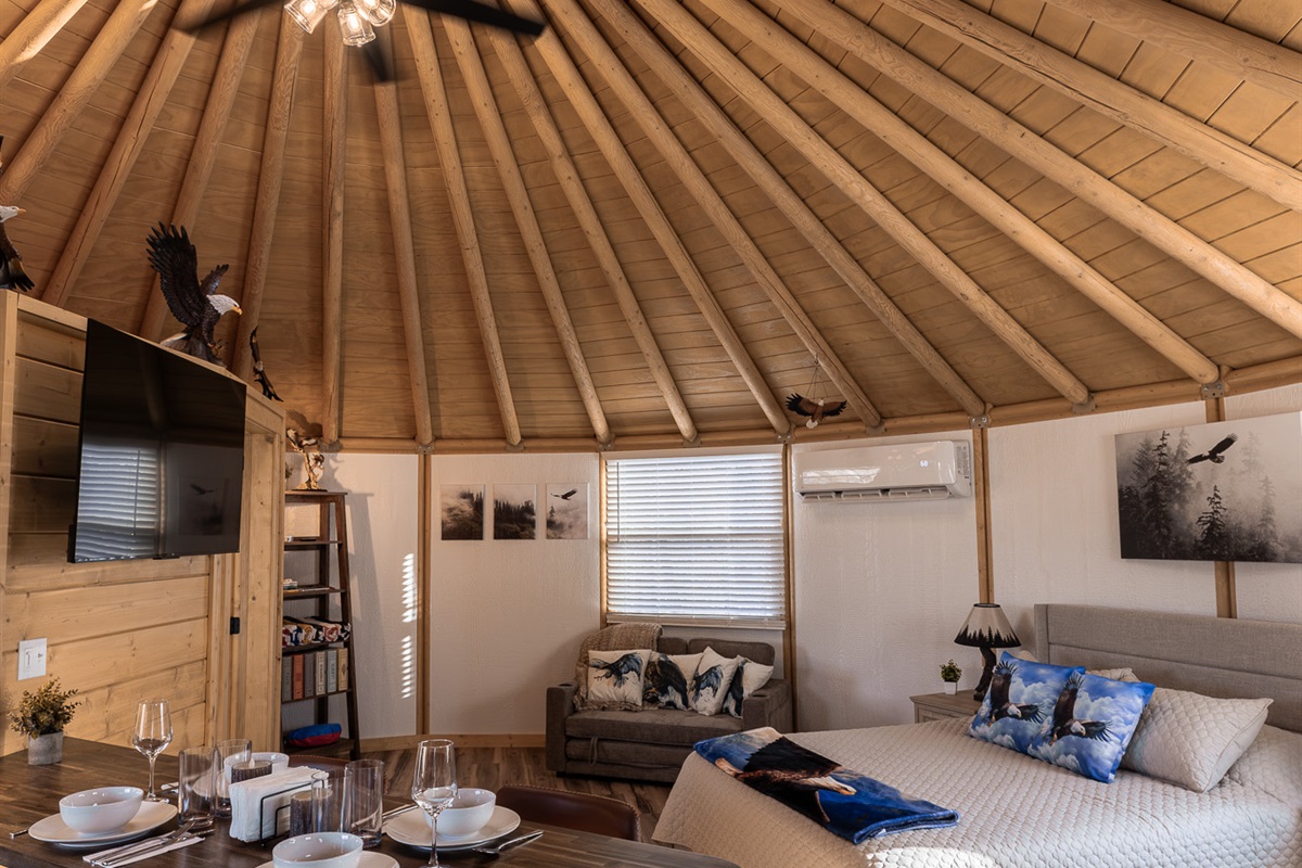 Soaring wood-beam ceilings and a skylight above the bed create a truly one-of-a-kind dome experience—designed to feel open, cozy, and unforgettable.