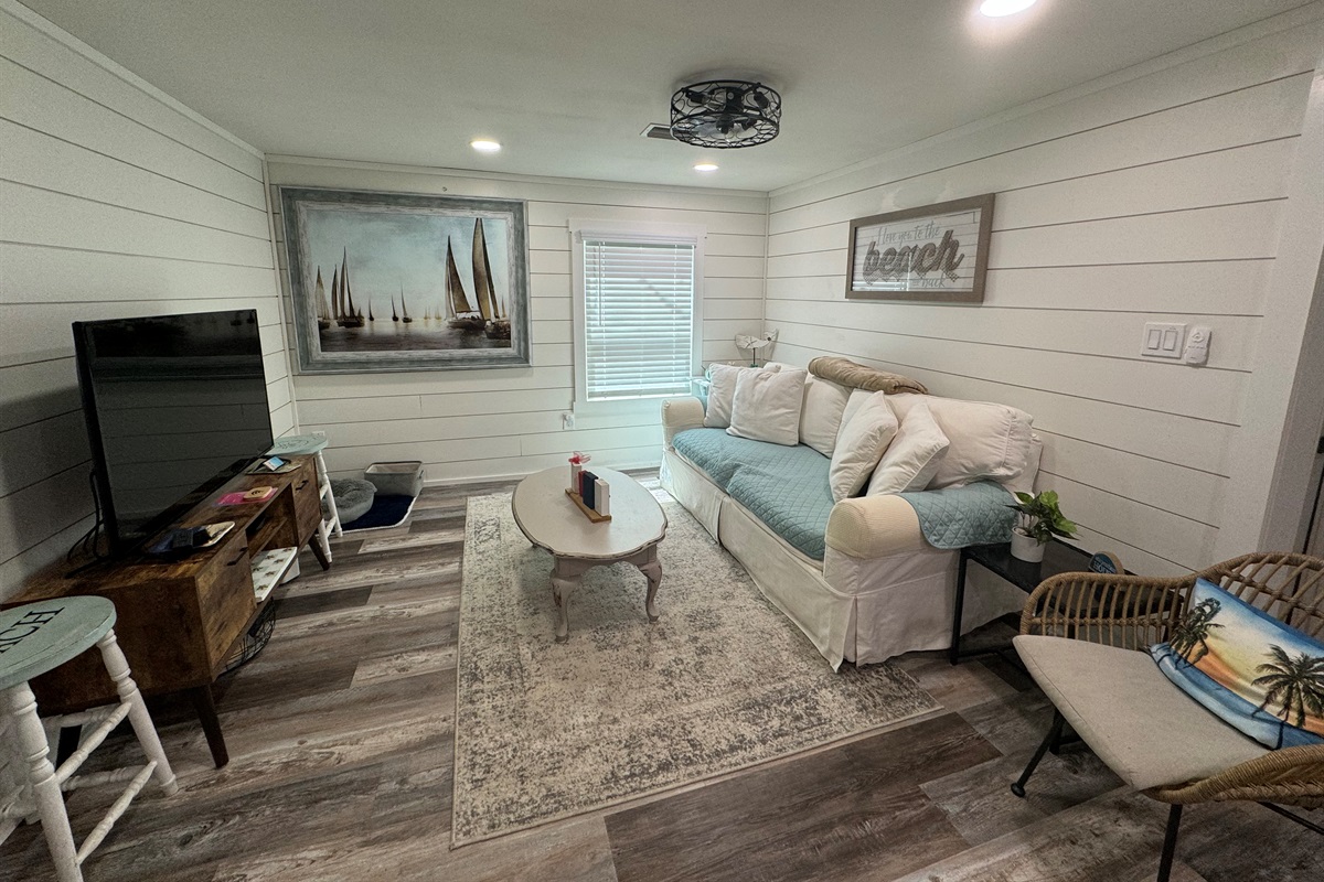 Living area with comfy couch and smart tv