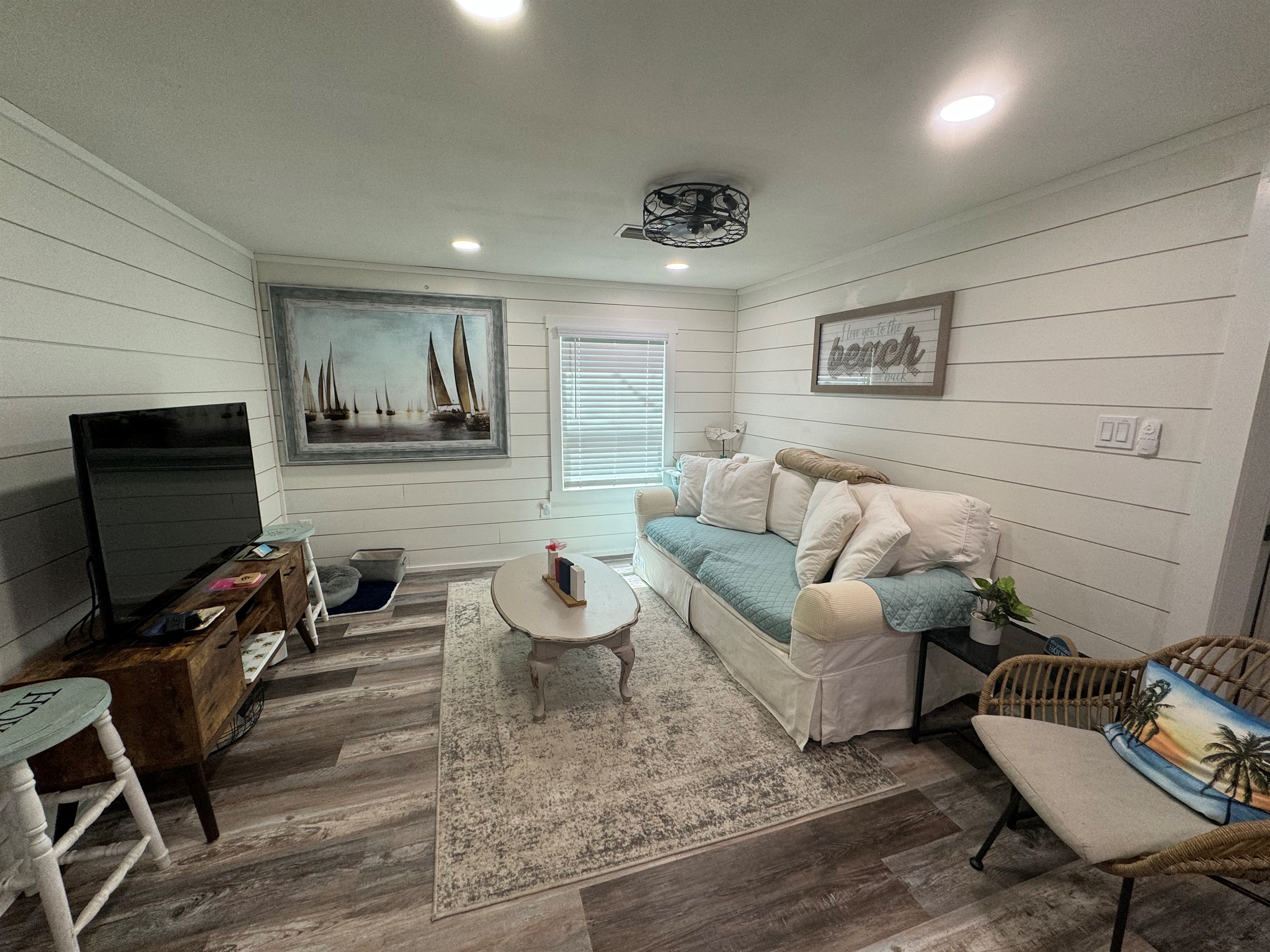 Living area with comfy couch and smart tv