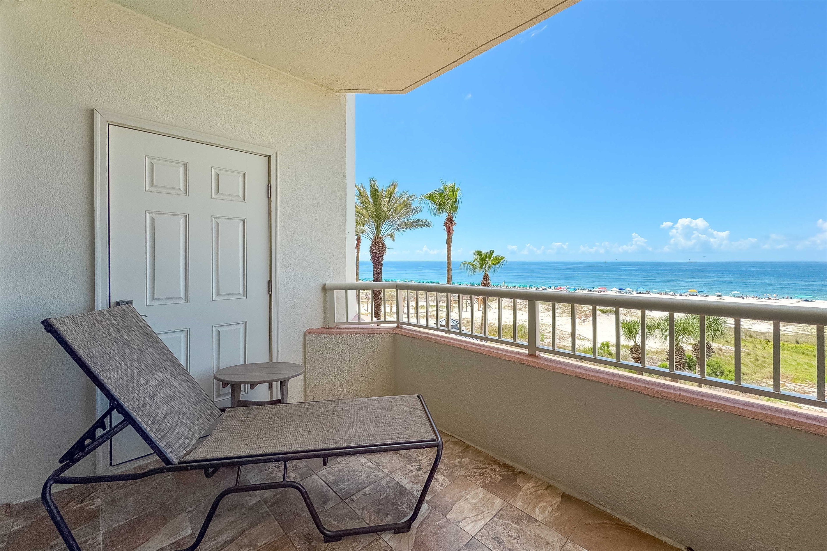 Natural textures and soft patterns create a serene and inviting corner, perfectly positioned to enjoy the expansive ocean views.