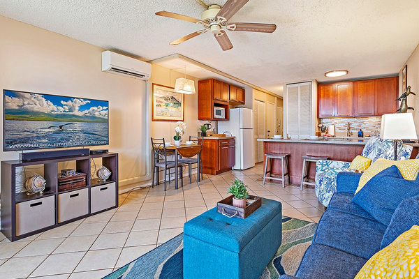 Open concept dining and living area with 50 inch smart TV.