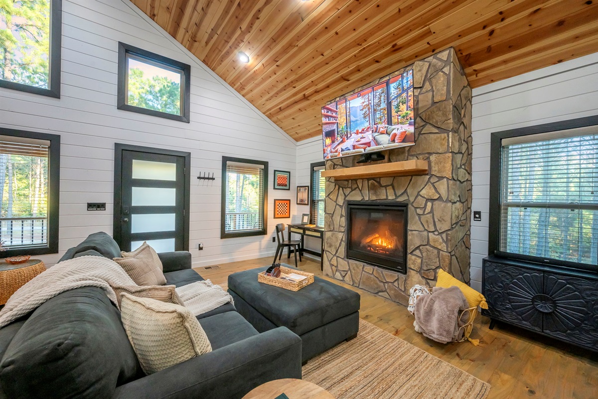 🔥 Fireside snuggles + forest views = perfection