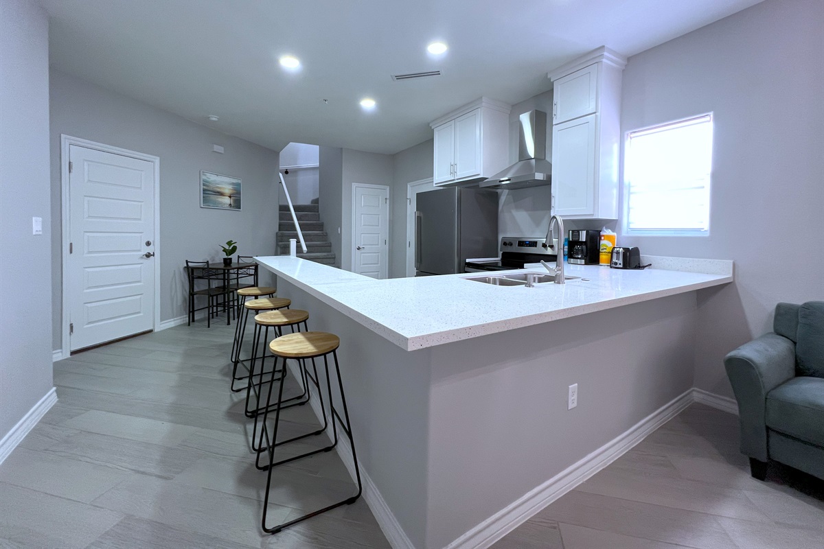 Kitchen with Dining Table and Bar Seating