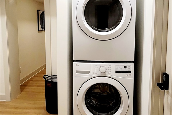Brand new stacked washer and dryer for guest use. 