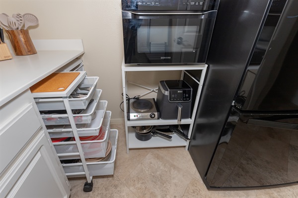 Cooking setup with air fryer, hot plate, and essentials