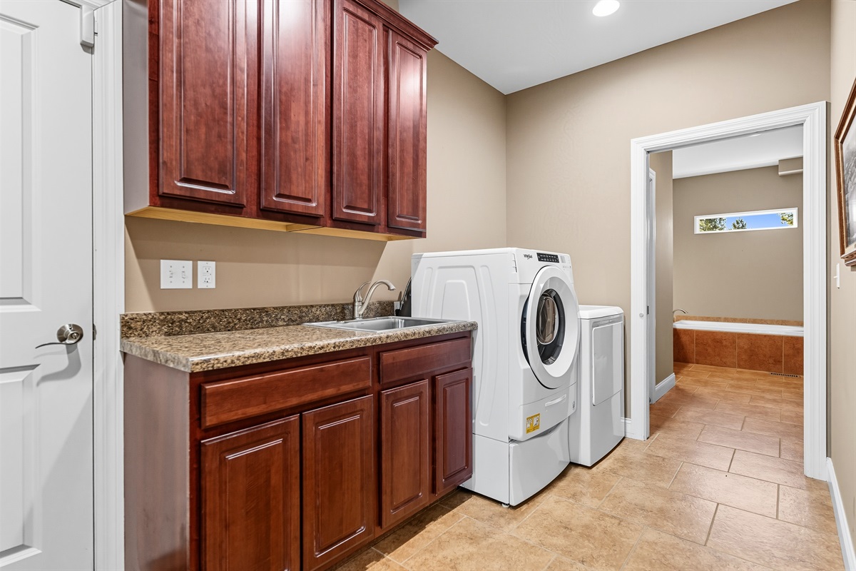 Laundry made easy. Full-size washer, dryer, and soap pods included - stay as long as you like.