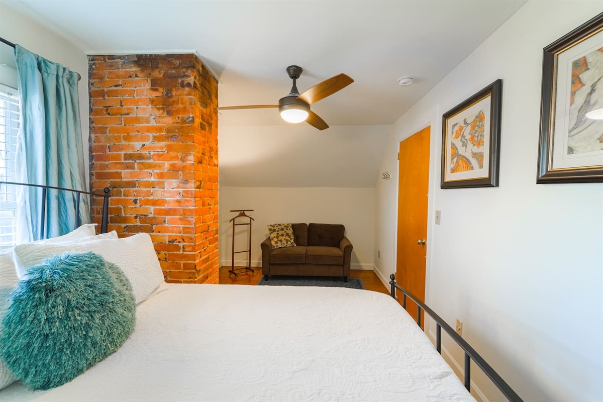 A lovely sitting area is offered in your bedroom. 