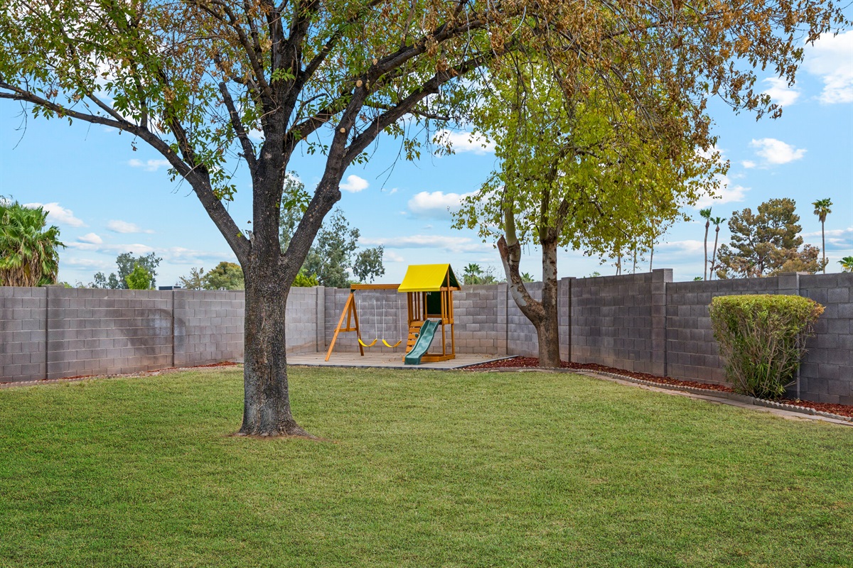 Send the kids out to run around and play in this spacious, green yard