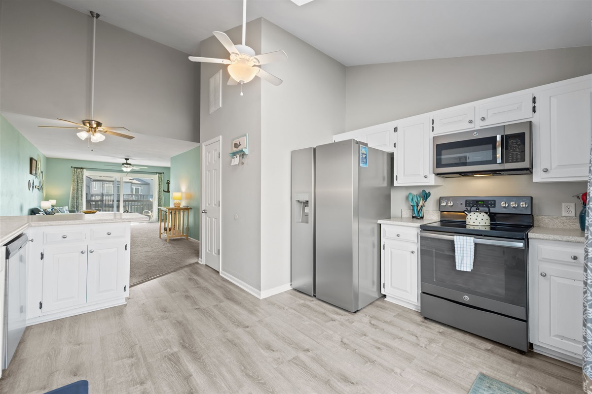Spacious kitchen with stainless appliances and an open view into the living area so you can cook while staying part of the conversation