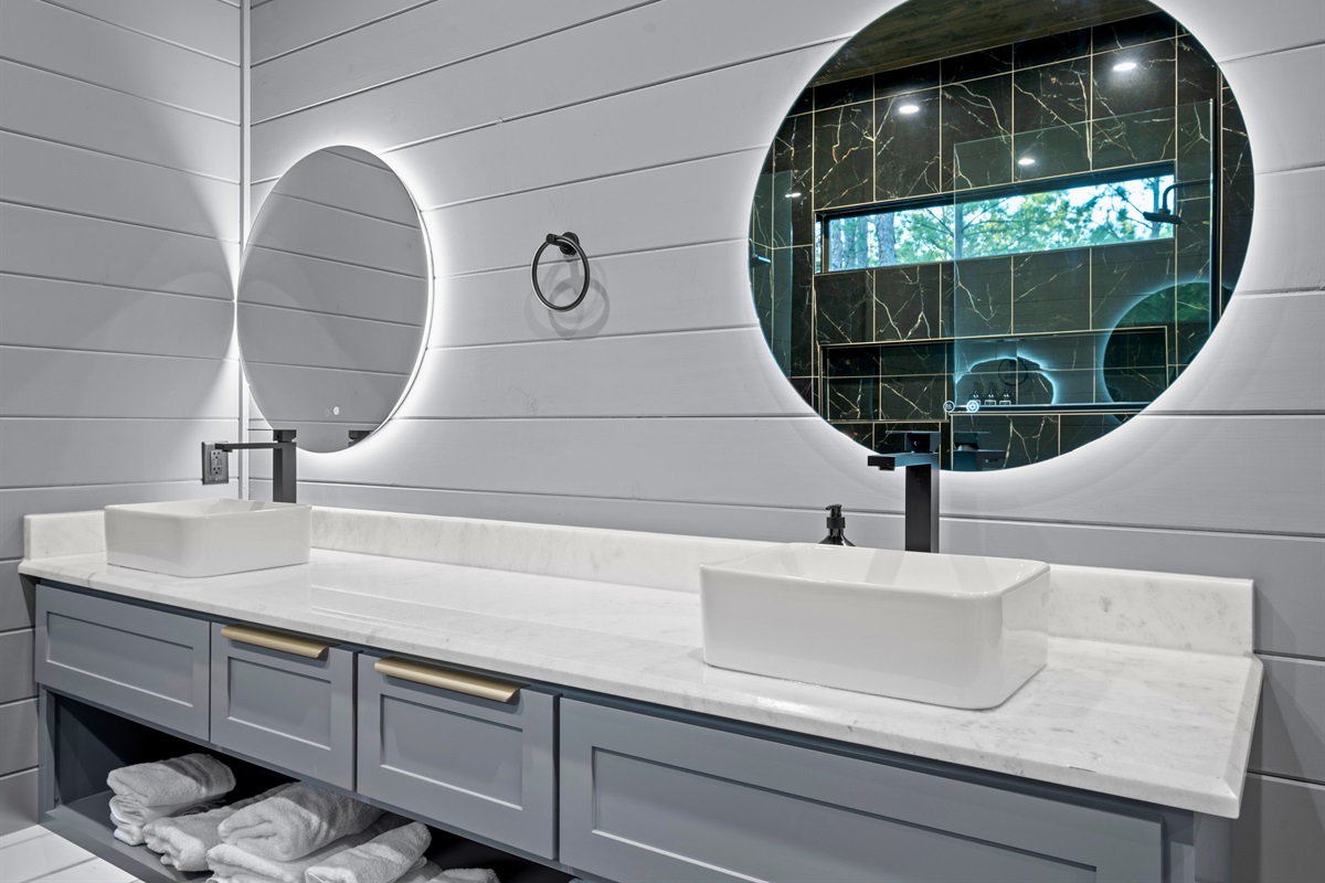 A long double vanity provides generous space for guests to spread out while getting ready for the day ahead.