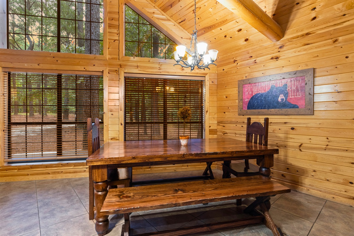 Dining nook with rustic chandelier and cozy bench seating