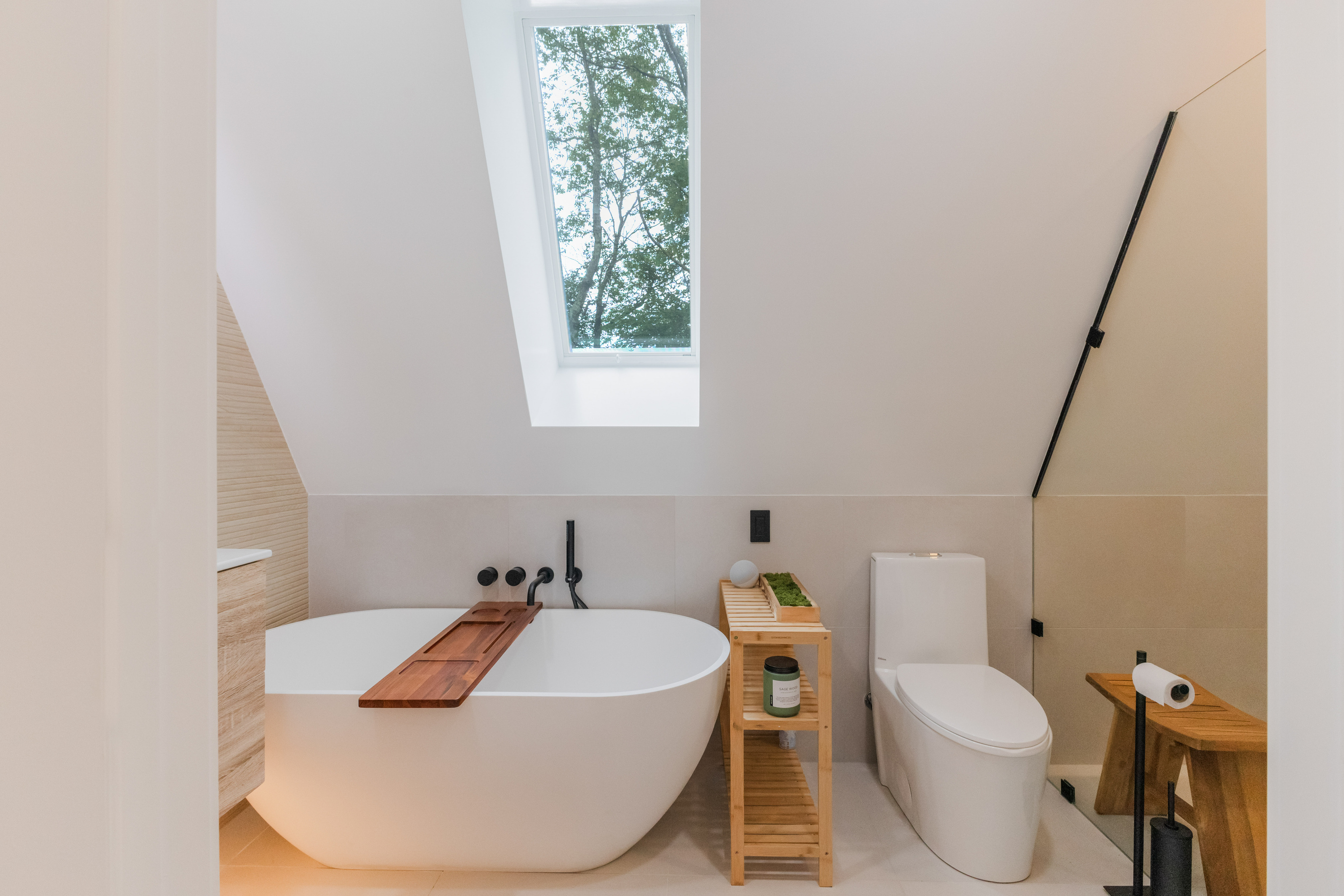 Soaking tub beneath a skylight