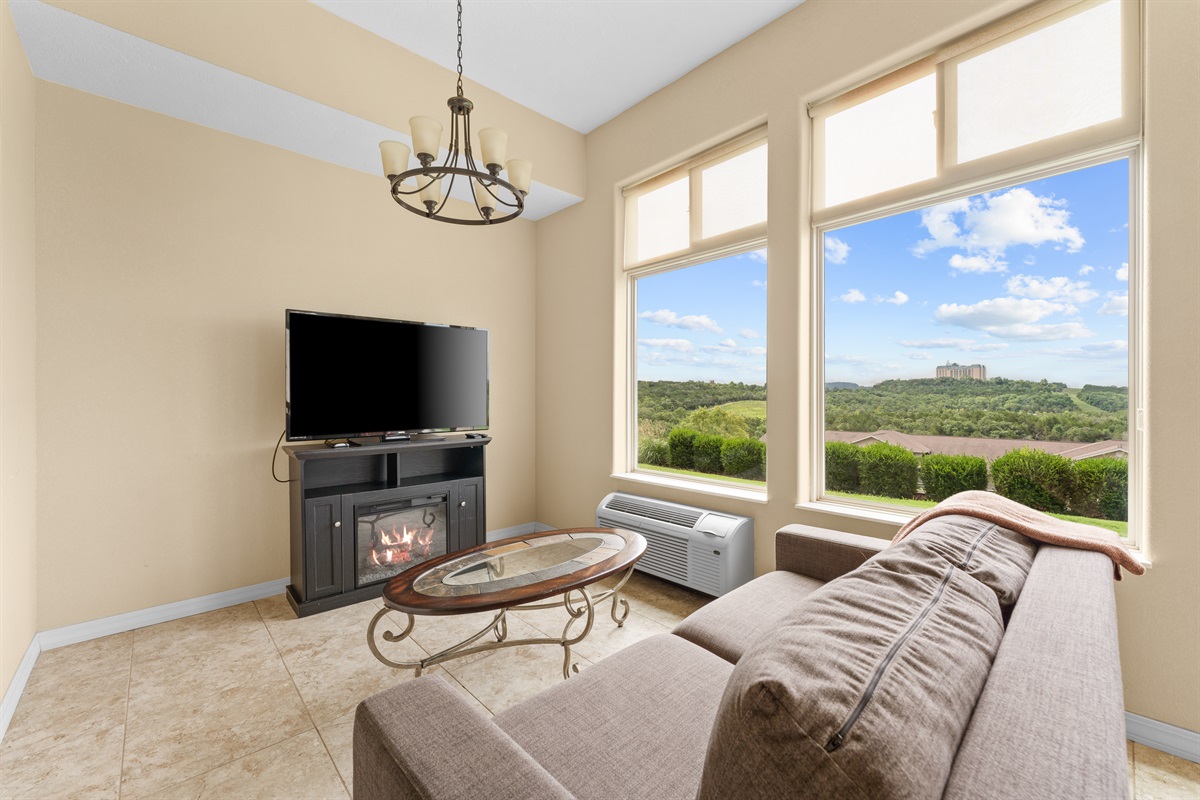 Another cozy angle on the sunroom lounge, where the lake becomes part of the backdrop.