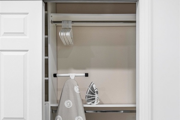Convenient closet with ironing board and storage for easy stay prep