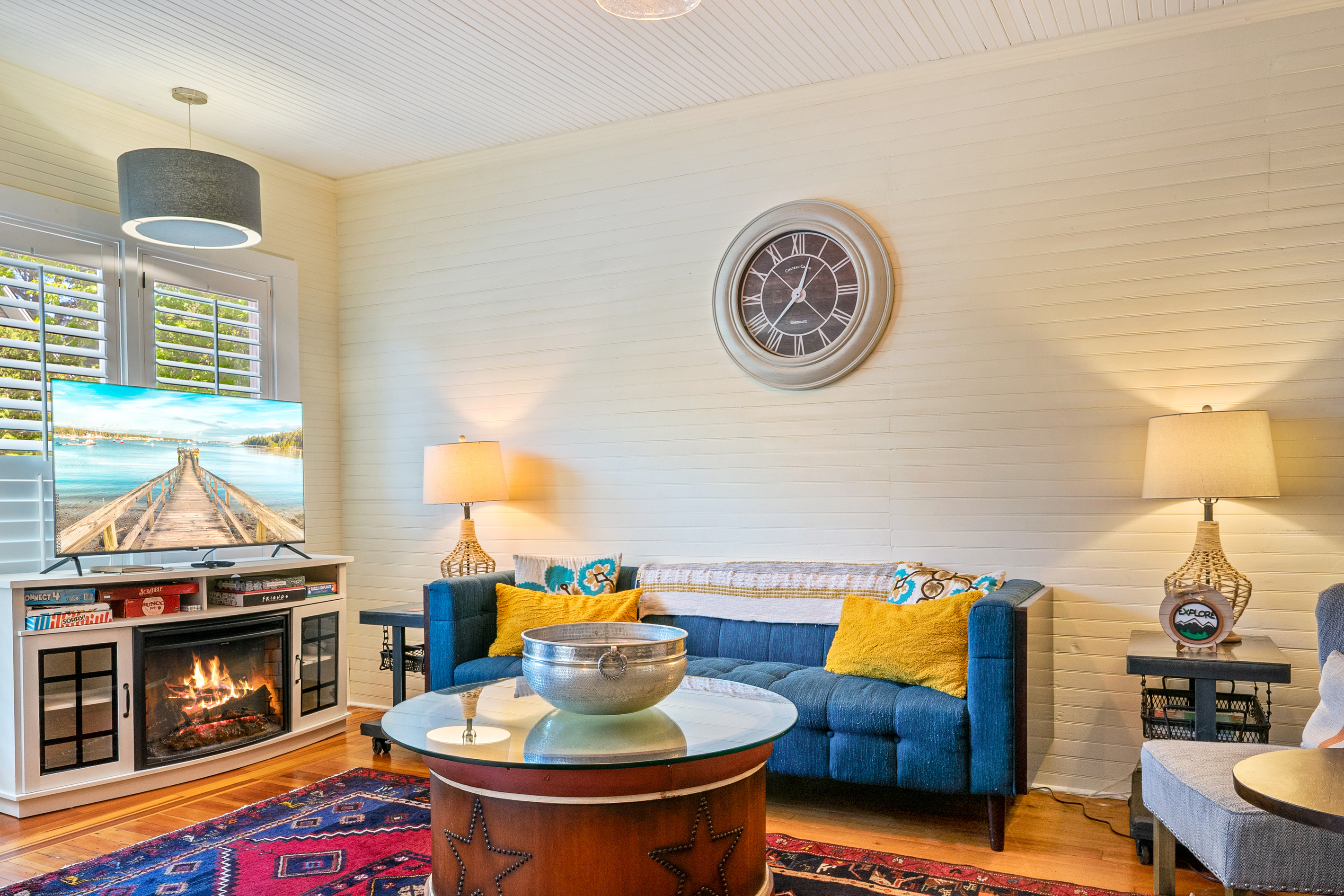 The ship’s upper lounge welcomes the crew with historic shiplap walls and a new electric fireplace console. Gather here for board game tournaments or stream evening entertainment on the 50-inch Roku TV powered by high-speed internet.