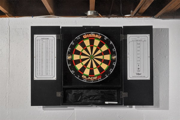 Unwind and have fun in the basement game area with darts!