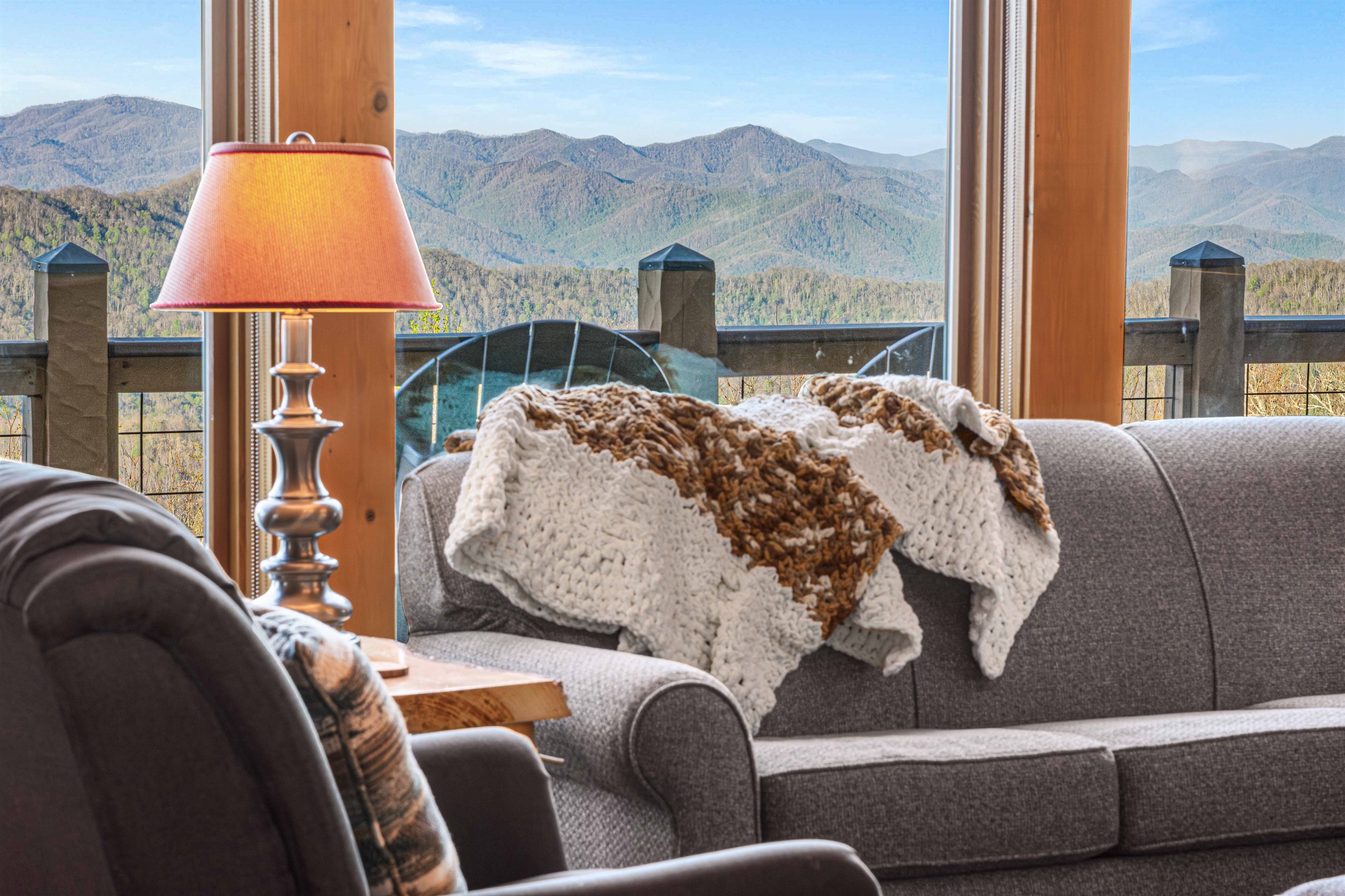 Living Room: Stunning mountain views paired with plush seating for ultimate relaxation!