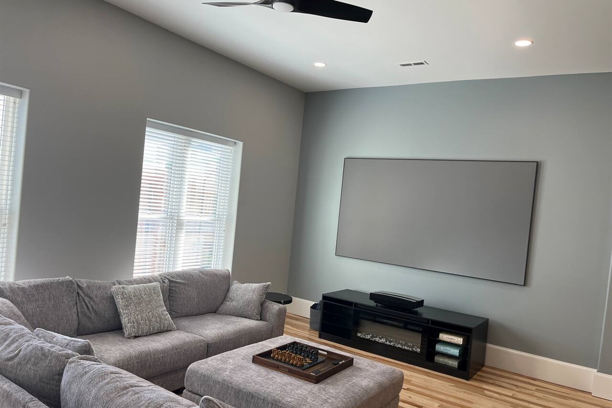 Cozy up to the high end electric fireplace and watch your favorite show on the 120’ high def screen!  