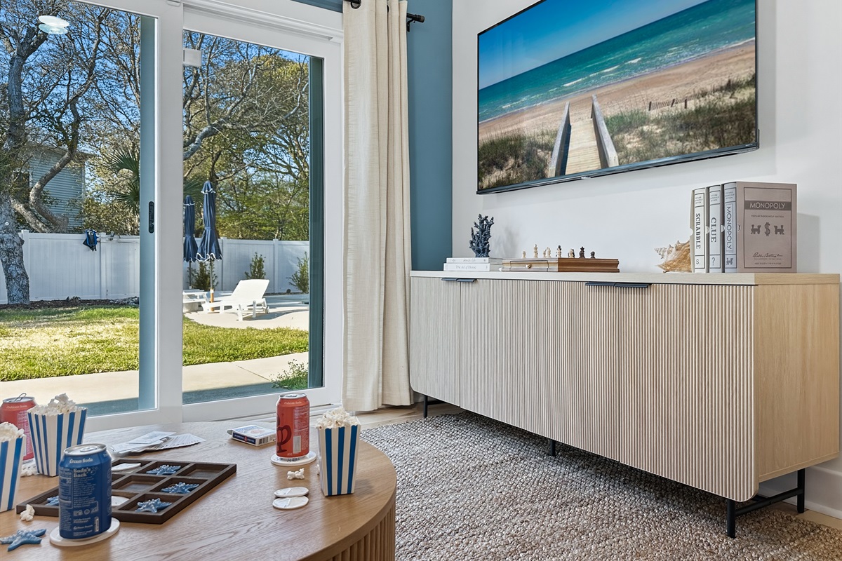 The sliding glass doors lead you to the backyard.