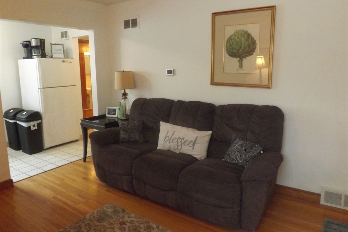 Reclining sofa with large Roku smart TV in living room
