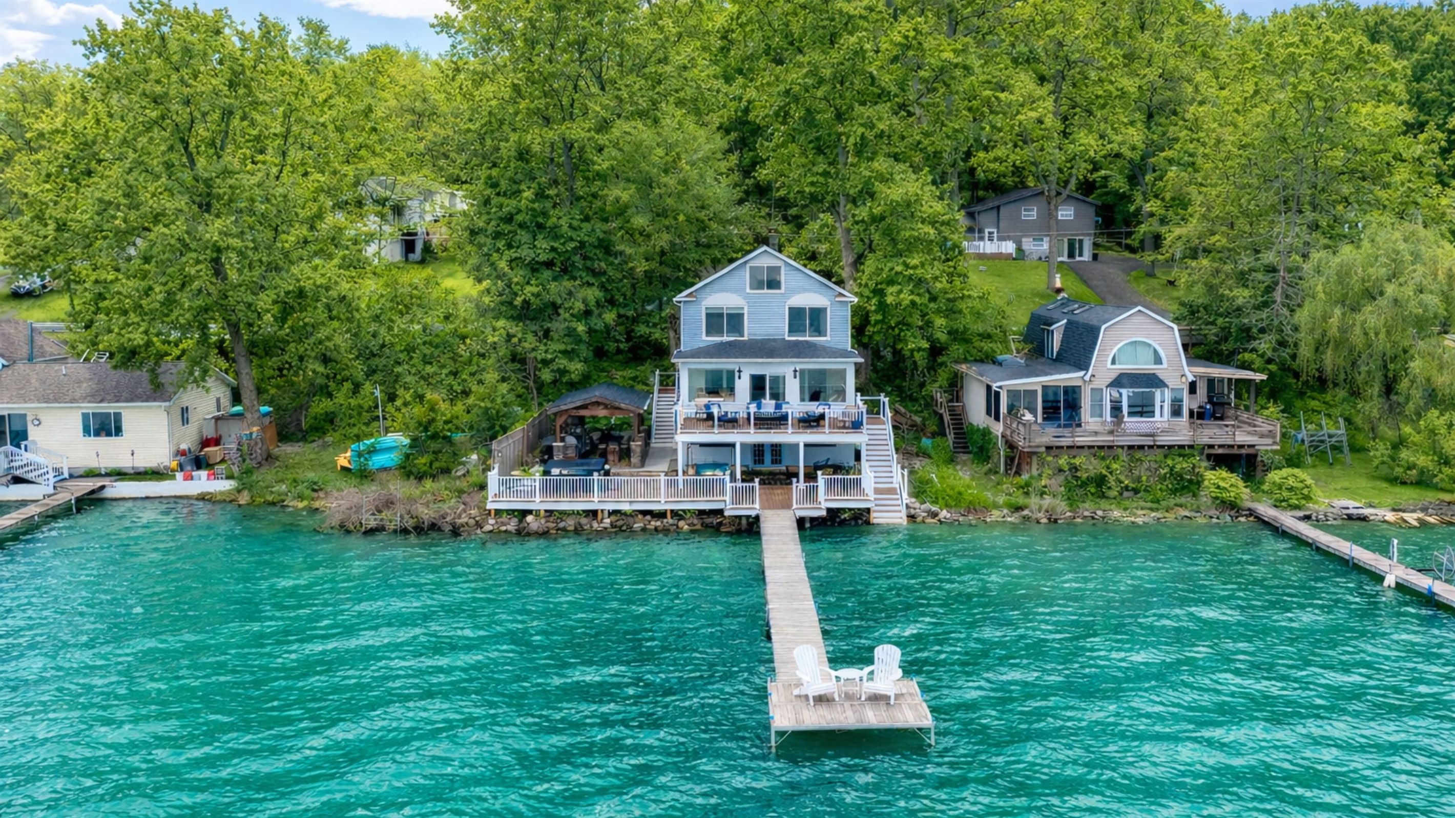 Stunning lakefront home with multi-level decks and a private dock—perfect for sunrise coffees and sunset cocktails 🌅🏡🚤