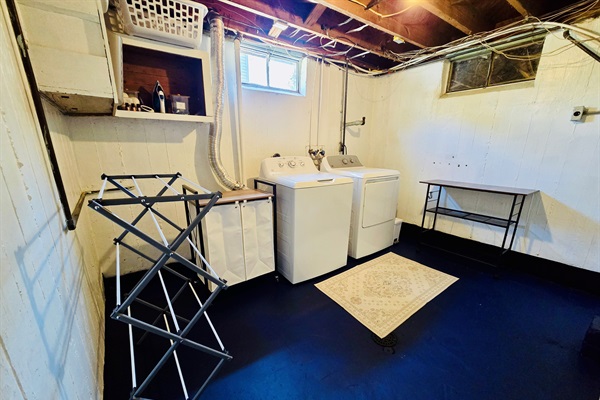 Laundry made easy—our crisp, clean basement setup features oversized machines, a folding table, drying rack, laundry bins and baskets, plus an iron and board. Stocked with supplies, wool dryer balls, and essential oils so you can choose your favorite scent