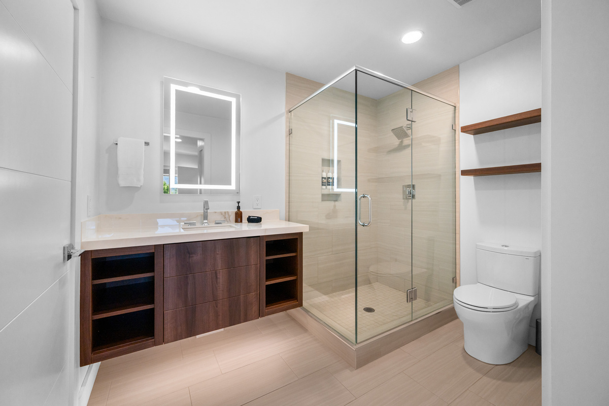 Spacious primary ensuite bathroom with a large walk-in shower and modern finishes.