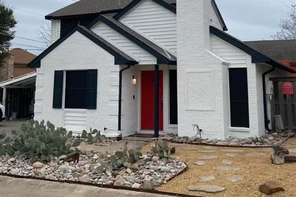Exterior view of home with private driveway and modern design.