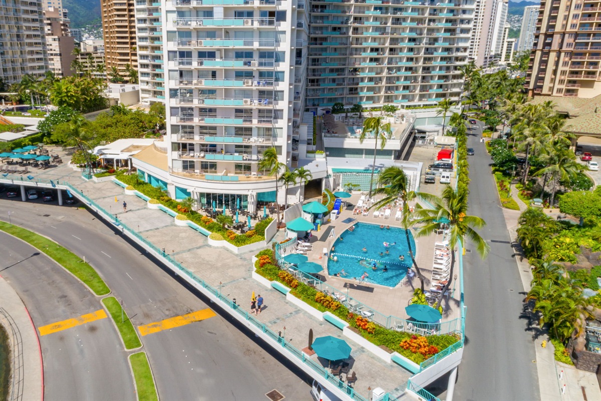 Aerial view of the Ilikai Hotel back area showing the promenade that leads to the beach as well as the hotel pool on the lobby deck