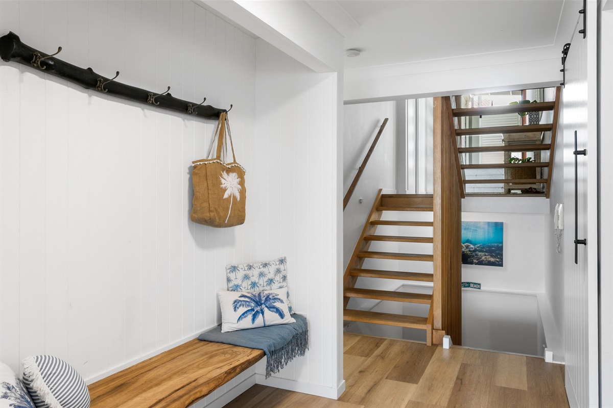 Beautiful timber staircases separate the 3 levels.