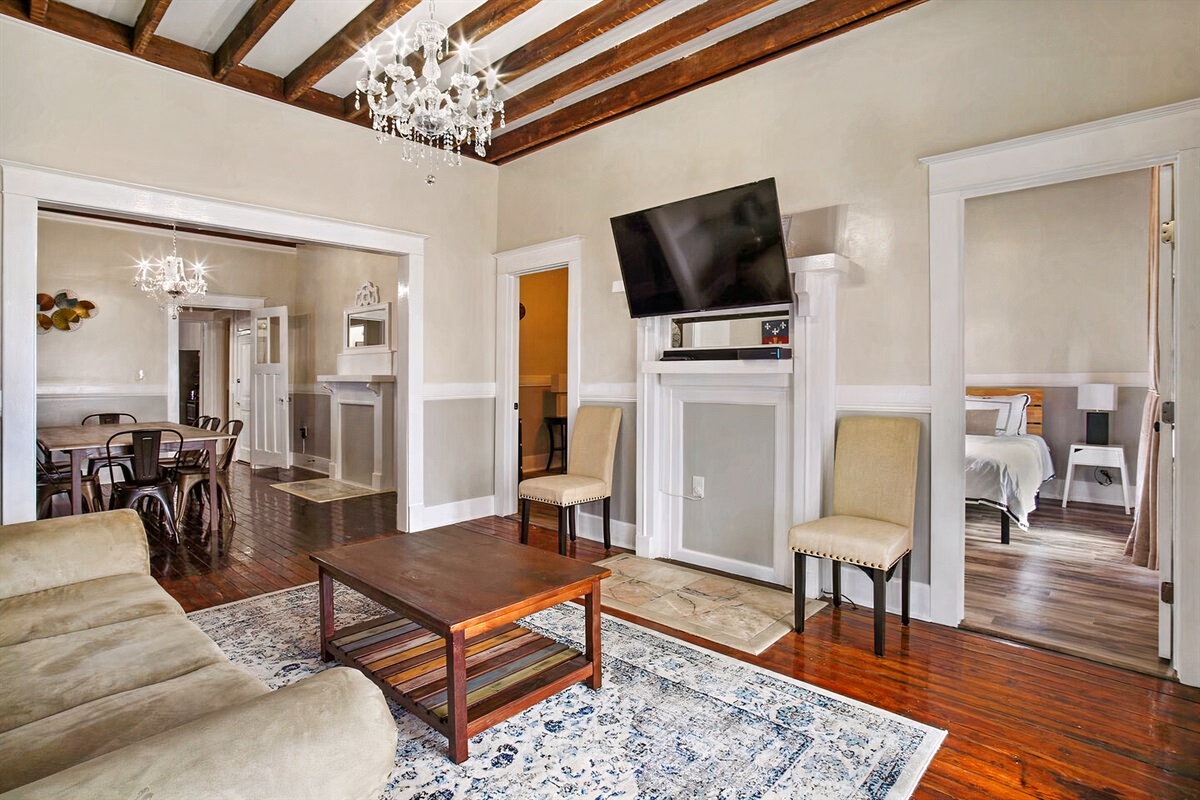 Living room looking into bedrooms 4 & 5. love seat for additional seating.