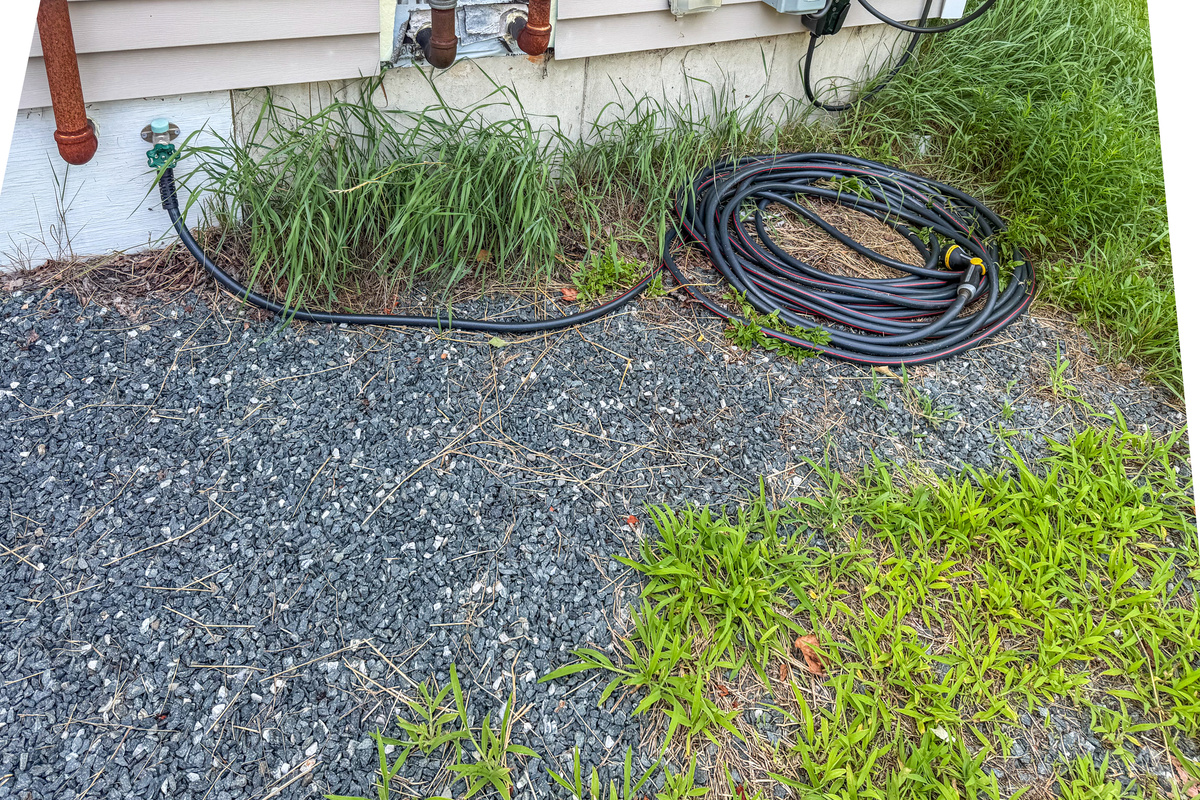 Wash outdoor gear, trail mud, or muddy paws easily using the high-flow outdoor hose station. This dedicated gravel-base wash area is located on the side of the home right next to the driveway, making cleanup fast after regional trail adventures.