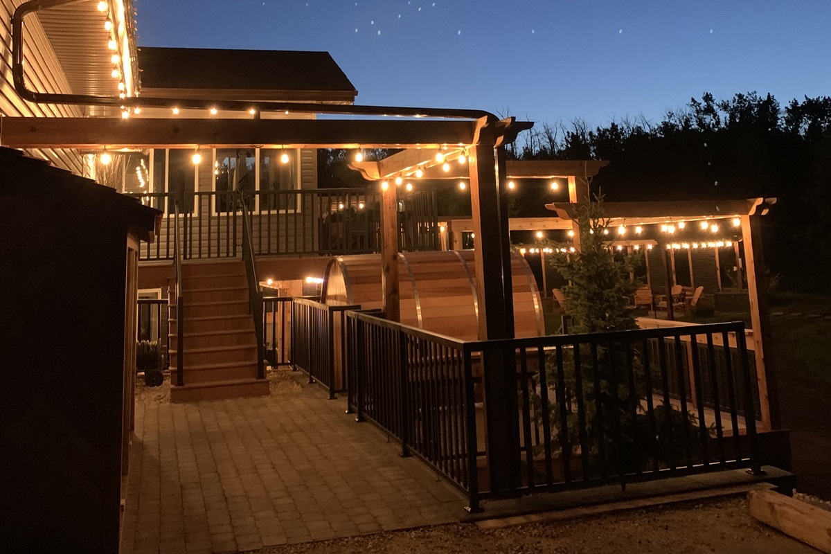 COURT YARD ENTRY EVENING. LOTS OF DECK LIGHTING TO MAKE YOUR EVENING LAST AS LONG AS YOU CAN.