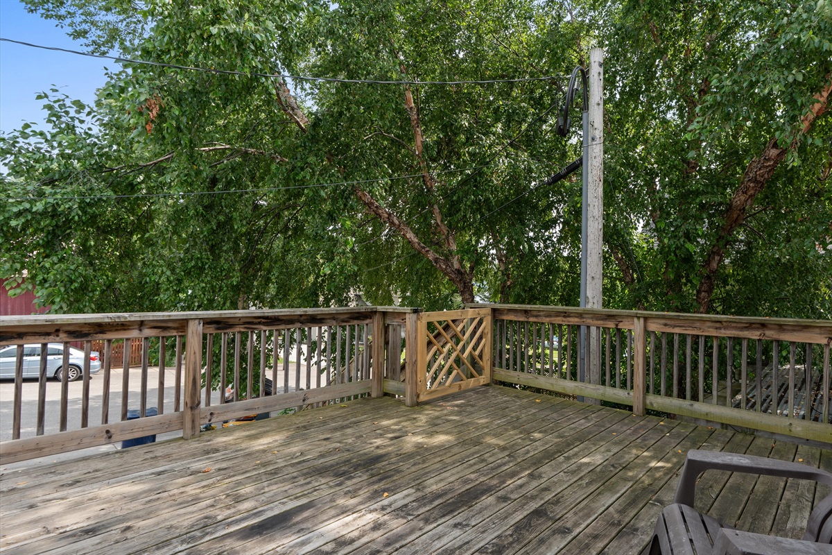 Catch the sunset from the attached deck through the neighboring trees.