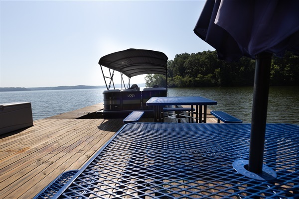 Dockside seating to relax by the water—perfect for morning coffee or sunset views while the pontoon awaits.