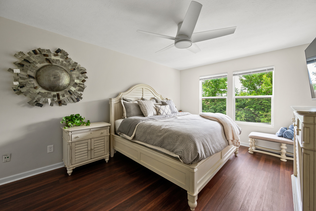 Bedroom 2 features a comfortable king-size bed and large windows that fill the space with natural light, creating a bright and inviting place to relax and recharge.
