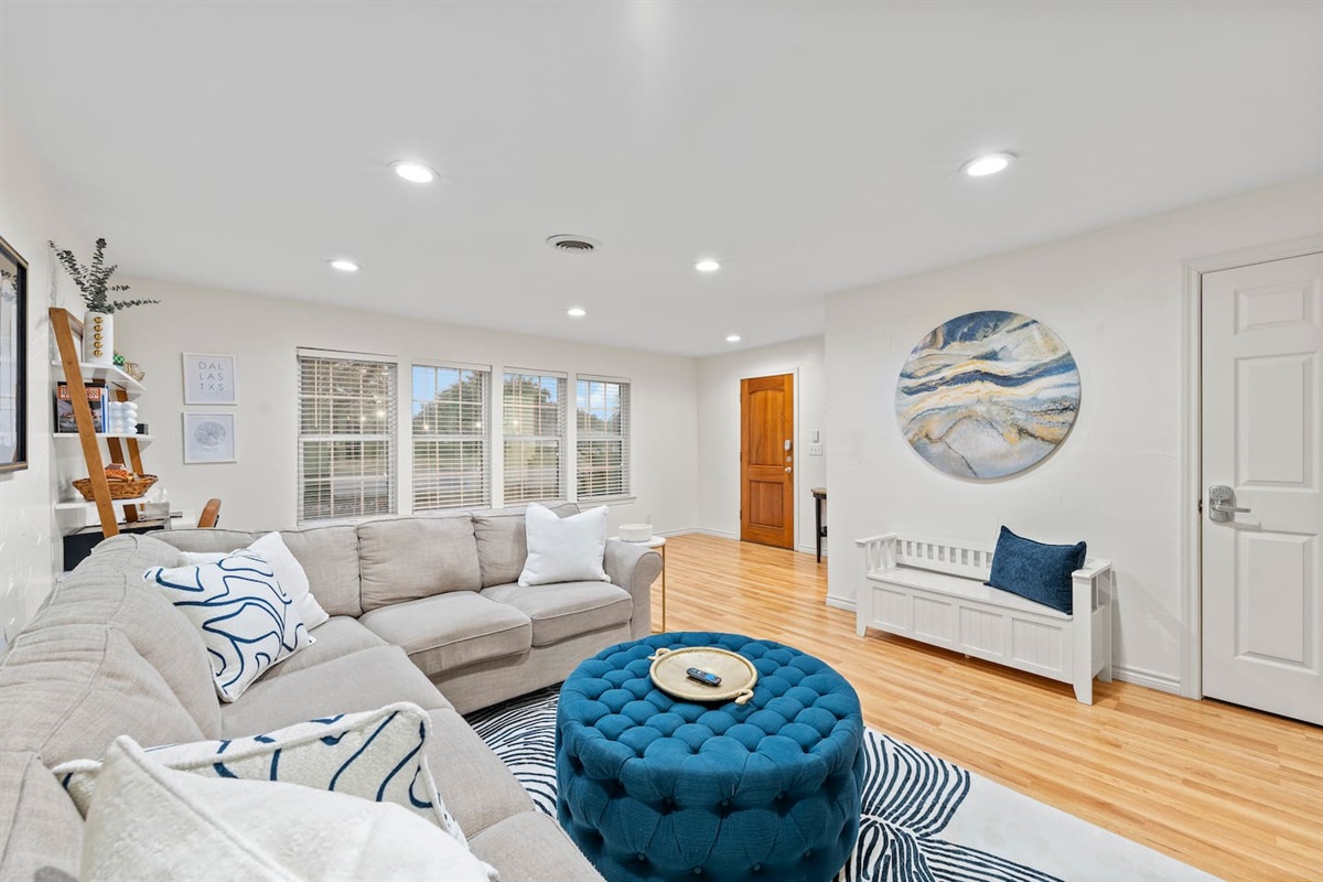 Warm welcome with statement art, a comfy bench for shoes or bags, and a seamless flow into the main living space.